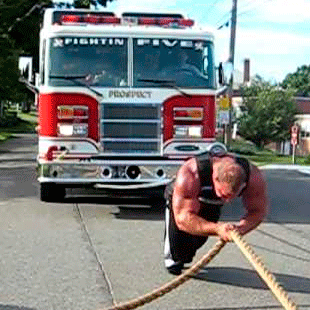 A man in Canada can pull a fire truck.